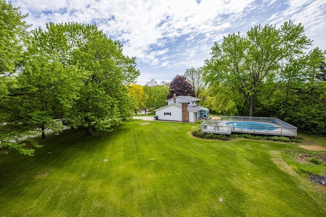 12105 W Shawnee Pass, Mequon, WI 53097 - view of green lawn with an outdoor pool