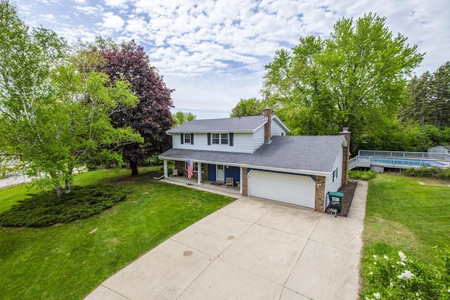 12105 W Shawnee Pass, Mequon, WI 53097 - view of front facade with a porch, driveway, a front yard, and an attached garage