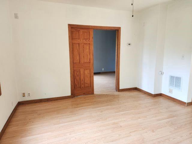 1561 240th Ave, Luck, WI 54853 - unfurnished room with light wood-style flooring and baseboards