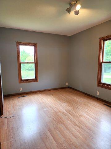 1561 240th Ave, Luck, WI 54853 - unfurnished room with light wood-style floors and baseboards