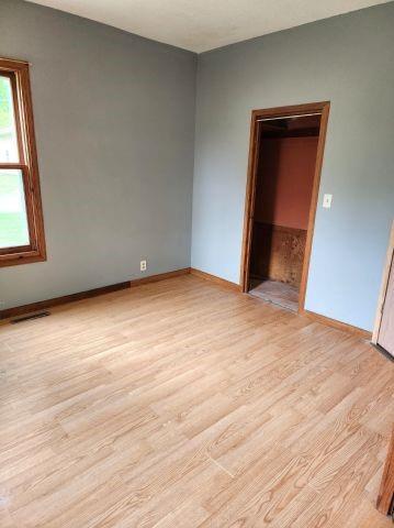 1561 240th Ave, Luck, WI 54853 - unfurnished room with light wood-style flooring and baseboards