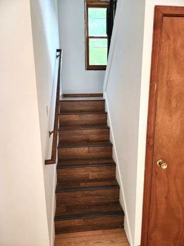 1561 240th Ave, Luck, WI 54853 - stairs featuring wood finished floors and baseboards