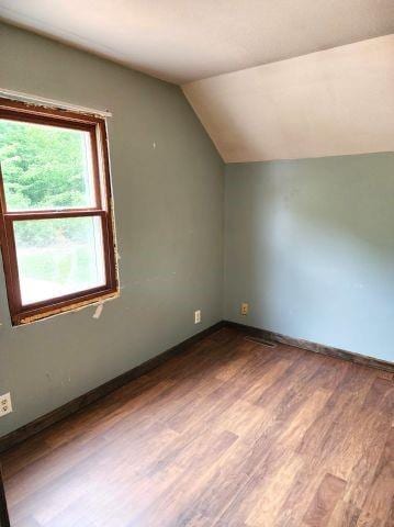 1561 240th Ave, Luck, WI 54853 - bonus room with dark wood finished floors, lofted ceiling, and baseboards