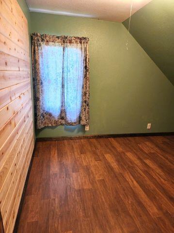 1561 240th Ave, Luck, WI 54853 - bonus room with wood finished floors, vaulted ceiling, and baseboards