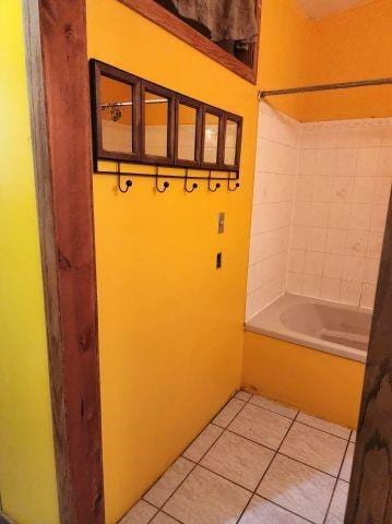 1561 240th Ave, Luck, WI 54853 - bathroom with tile patterned flooring and bathing tub / shower combination