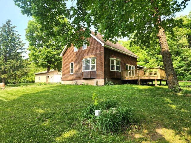 1561 240th Ave, Luck, WI 54853 - view of home's exterior featuring a deck and a yard
