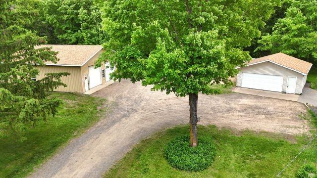1561 240th Ave, Luck, WI 54853 - view of front facade featuring a garage and an outdoor structure