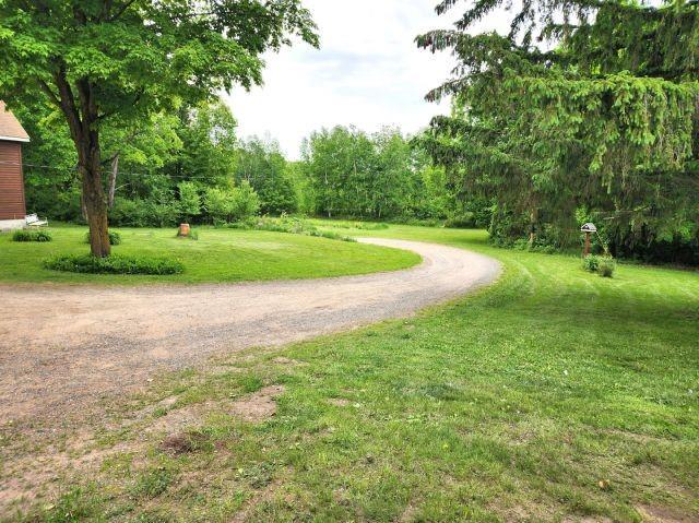 1561 240th Ave, Luck, WI 54853 - view of home's community featuring driveway and a lawn