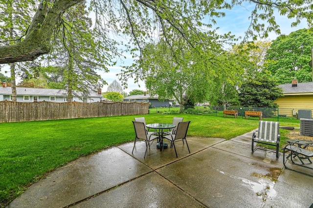 7538 S 74th St, Franklin, WI 53132 - view of patio featuring outdoor dining area and central AC unit