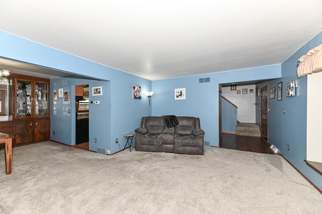 7538 S 74th St, Franklin, WI 53132 - carpeted living room featuring stairway and baseboards