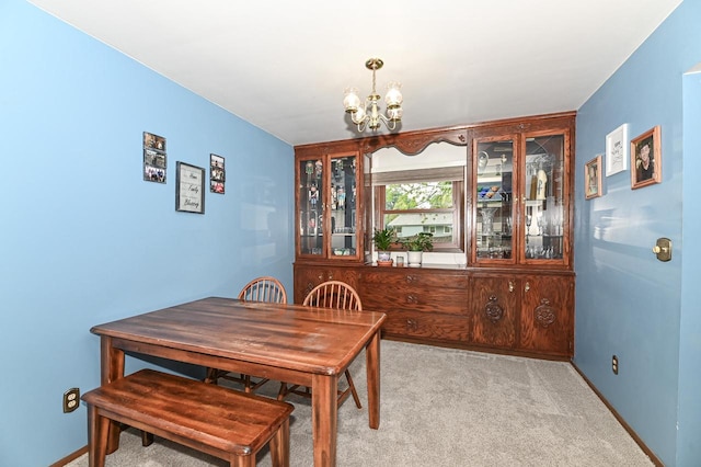 7538 S 74th St, Franklin, WI 53132 - dining room featuring a chandelier, light carpet, and baseboards