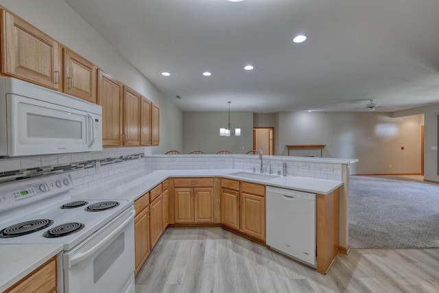 W159N4872 Graysland Dr, Menomonee Falls, WI 53051 - kitchen featuring white appliances, a peninsula, a sink, ceiling fan, and light countertops