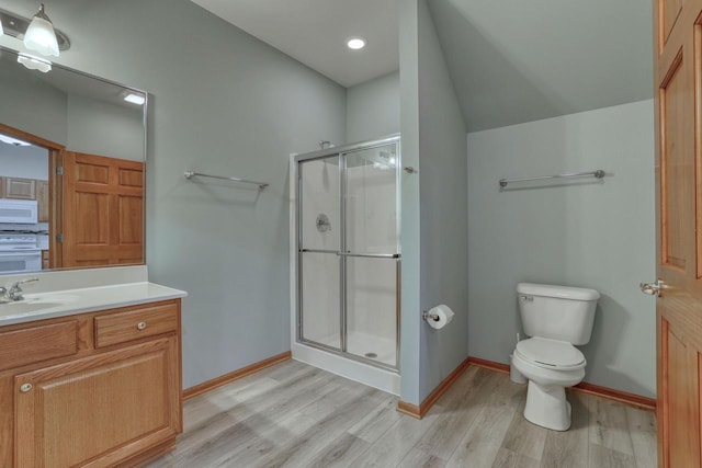 W159N4872 Graysland Dr, Menomonee Falls, WI 53051 - bathroom with wood finished floors, vanity, a stall shower, toilet, and baseboards
