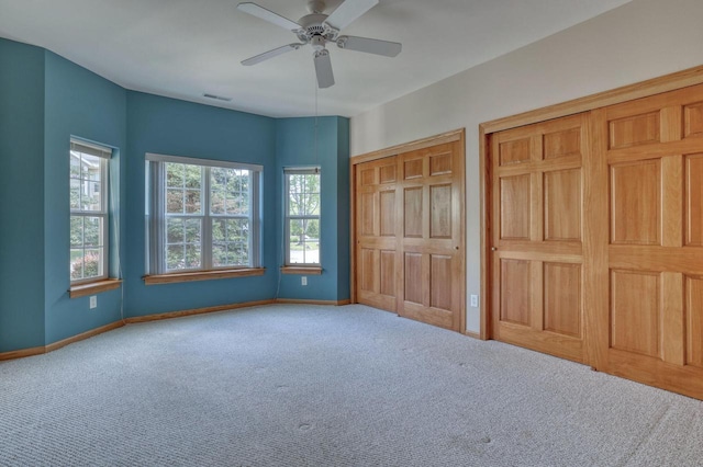 W159N4872 Graysland Dr, Menomonee Falls, WI 53051 - unfurnished bedroom featuring multiple closets, carpet floors, baseboards, and ceiling fan