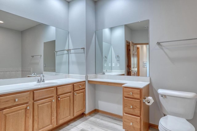 W159N4872 Graysland Dr, Menomonee Falls, WI 53051 - bathroom featuring wood finished floors, vanity, and toilet