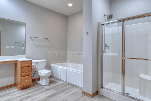 W159N4872 Graysland Dr, Menomonee Falls, WI 53051 - bathroom with toilet, a stall shower, a bath, wood finished floors, and vanity