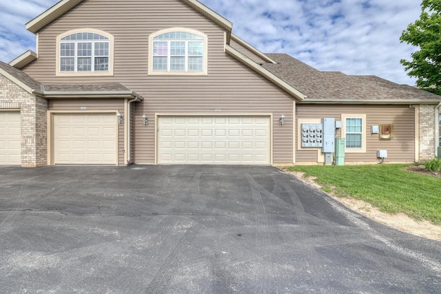 W159N4872 Graysland Dr, Menomonee Falls, WI 53051 - view of property with driveway, an attached garage, and roof with shingles
