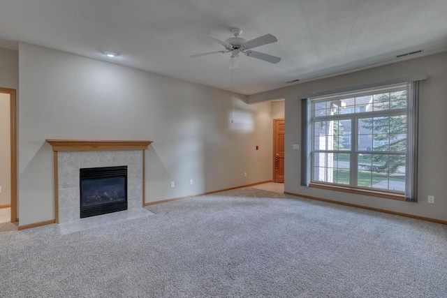 W159N4872 Graysland Dr, Menomonee Falls, WI 53051 - unfurnished living room featuring healthy amount of natural light, a ceiling fan, carpet floors, and baseboards