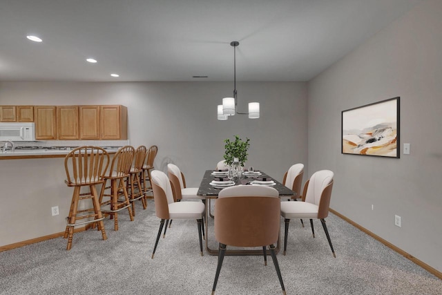 W159N4872 Graysland Dr, Menomonee Falls, WI 53051 - dining space with recessed lighting, light carpet, baseboards, and a chandelier