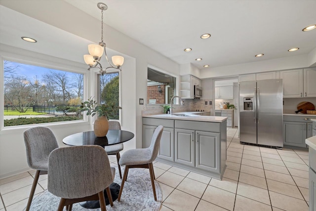4696 N Lake Dr, Whitefish Bay, WI 53211 - dining space featuring a chandelier, recessed lighting, and light tile patterned floors