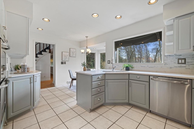 4696 N Lake Dr, Whitefish Bay, WI 53211 - kitchen featuring stainless steel dishwasher, gray cabinetry, a sink, recessed lighting, and light tile patterned floors