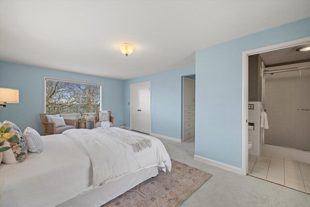 4696 N Lake Dr, Whitefish Bay, WI 53211 - carpeted bedroom with baseboards and ensuite bath
