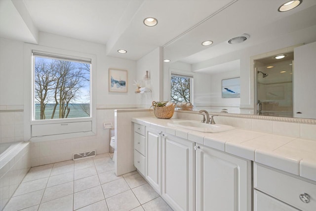 4696 N Lake Dr, Whitefish Bay, WI 53211 - full bath with tile patterned floors, toilet, vanity, recessed lighting, and a stall shower