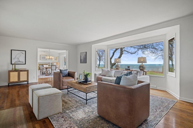 4696 N Lake Dr, Whitefish Bay, WI 53211 - living room featuring a chandelier, wood finished floors, baseboards, and baseboard heating
