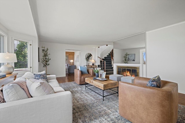 4696 N Lake Dr, Whitefish Bay, WI 53211 - living area featuring wood finished floors, stairs, baseboards, and a glass covered fireplace