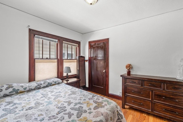 2049 S 77th St, West Allis, WI 53219 - bedroom featuring light wood-type flooring and baseboards