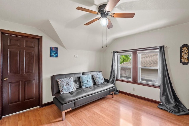 2049 S 77th St, West Allis, WI 53219 - living area with vaulted ceiling, a ceiling fan, light wood-style floors, and baseboards