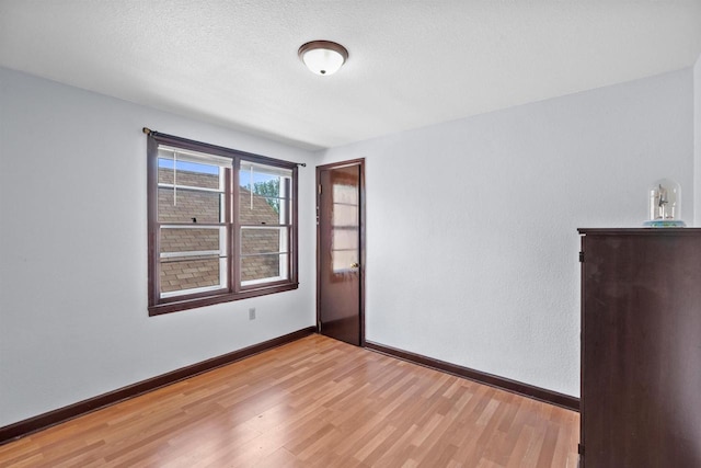 2049 S 77th St, West Allis, WI 53219 - empty room with light wood-style flooring and baseboards