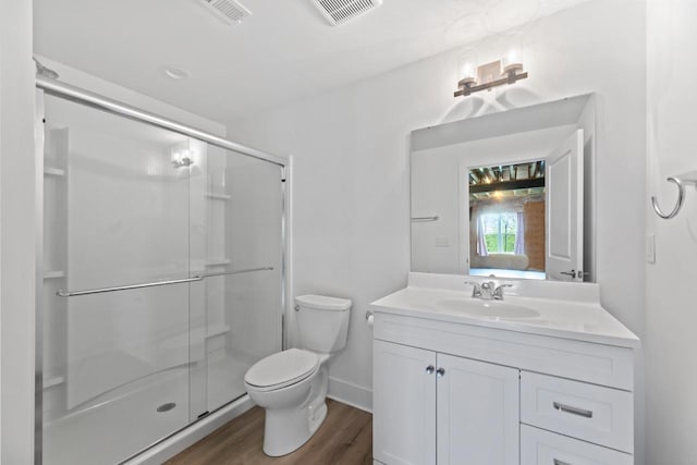529 Century Oak Dr, Waukesha, WI 53188 - bathroom featuring vanity, toilet, a shower stall, and wood finished floors