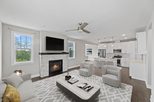 529 Century Oak Dr, Waukesha, WI 53188 - living area with healthy amount of natural light, wood finished floors, ceiling fan, recessed lighting, and baseboards