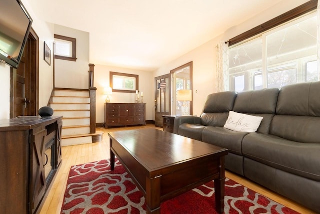 150 S James St, Waukesha, WI 53186 - living area with light wood-type flooring, plenty of natural light, and stairs
