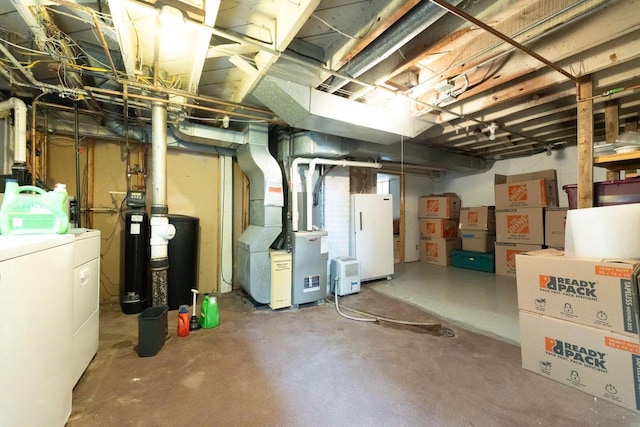 150 S James St, Waukesha, WI 53186 - unfinished basement featuring heating unit, a water softener system, and freestanding refrigerator