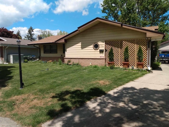9446 W Lynx Ct, Milwaukee, WI 53225 - view of side of home with a yard and brick siding