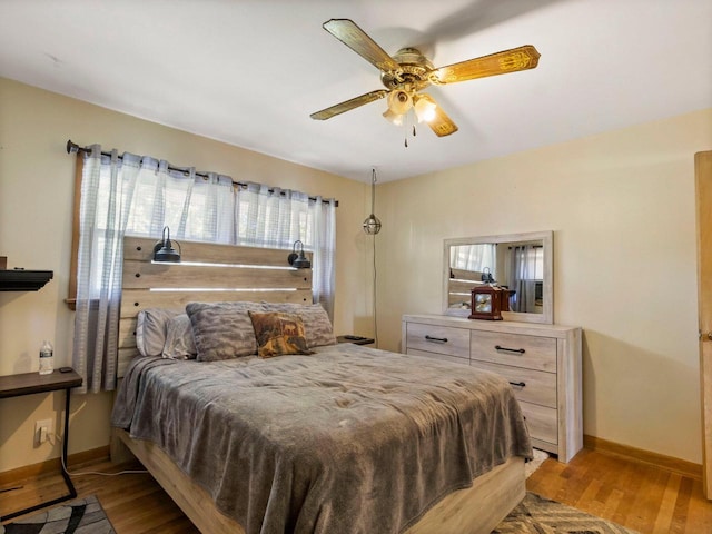 9446 W Lynx Ct, Milwaukee, WI 53225 - bedroom with baseboards, light wood-type flooring, and a ceiling fan