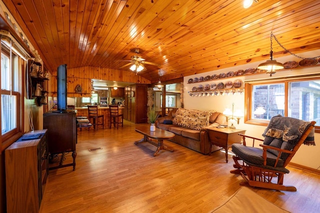 W2761 49th St, Mauston, WI 53948 - living area with lofted ceiling, light wood finished floors, wooden ceiling, healthy amount of natural light, and ceiling fan