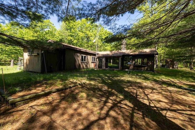 W2761 49th St, Mauston, WI 53948 - back of house with a yard