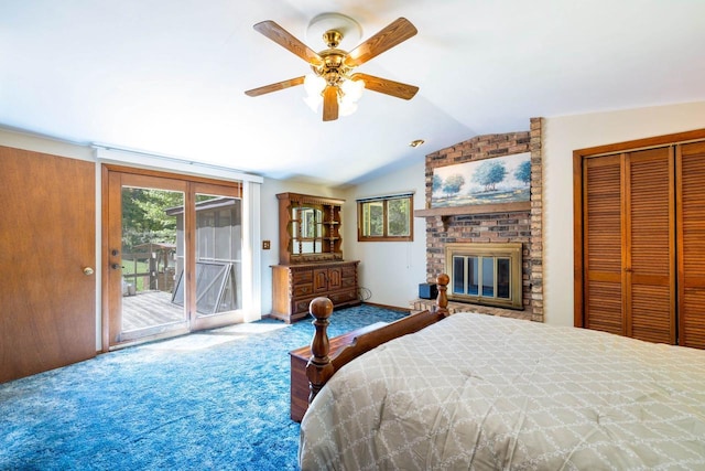 W2761 49th St, Mauston, WI 53948 - carpeted bedroom with lofted ceiling, access to exterior, a fireplace, a ceiling fan, and a closet