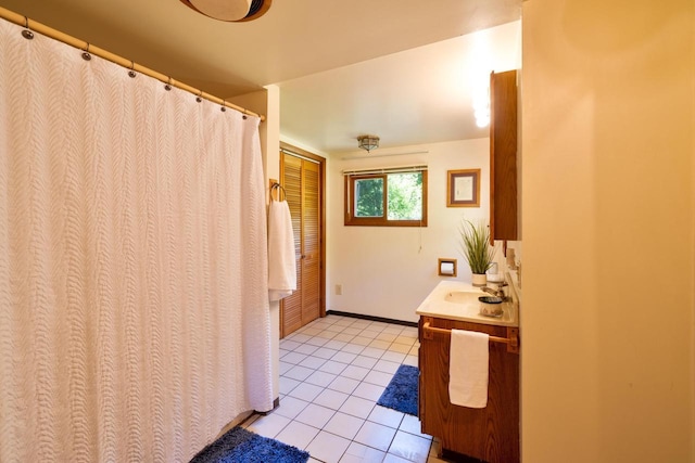 W2761 49th St, Mauston, WI 53948 - full bathroom featuring tile patterned flooring, vanity, baseboards, and a shower with shower curtain