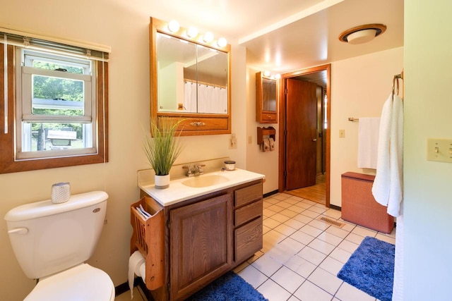 W2761 49th St, Mauston, WI 53948 - bathroom featuring vanity, toilet, and tile patterned flooring