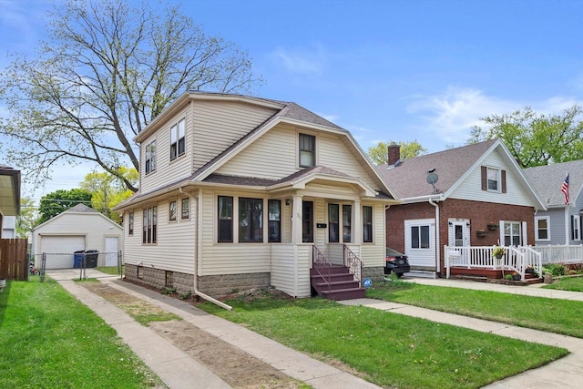 901 William St, Racine, WI 53402 - view of front of property featuring a detached garage, an outbuilding, driveway, and a shingled roof