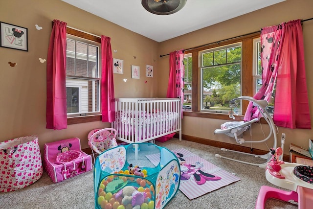 901 William St, Racine, WI 53402 - bedroom with carpet flooring, multiple windows, and baseboards