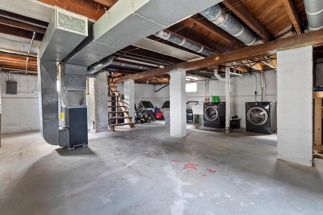 901 William St, Racine, WI 53402 - basement with independent washer and dryer, heating unit, and electric panel