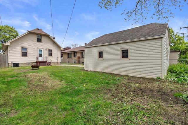 901 William St, Racine, WI 53402 - back of house with a shingled roof and central AC