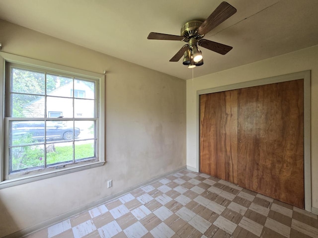 6455 N 56th St, Milwaukee, WI 53223 - unfurnished bedroom featuring multiple windows, a closet, and light floors