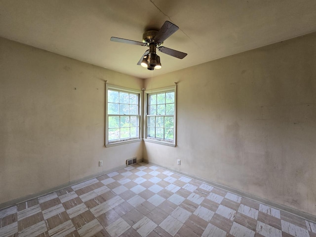 6455 N 56th St, Milwaukee, WI 53223 - empty room with tile patterned floors and ceiling fan