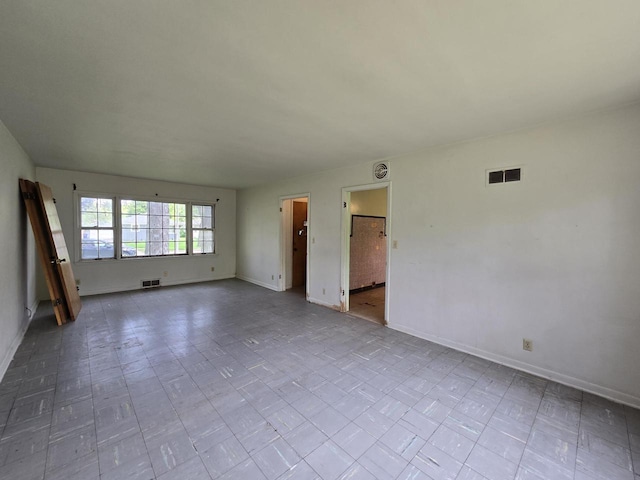 6455 N 56th St, Milwaukee, WI 53223 - spare room featuring baseboards